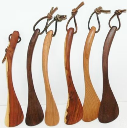 Six hand-carved wooden Chef's Tools in different woods, each with a leather hanging loop
